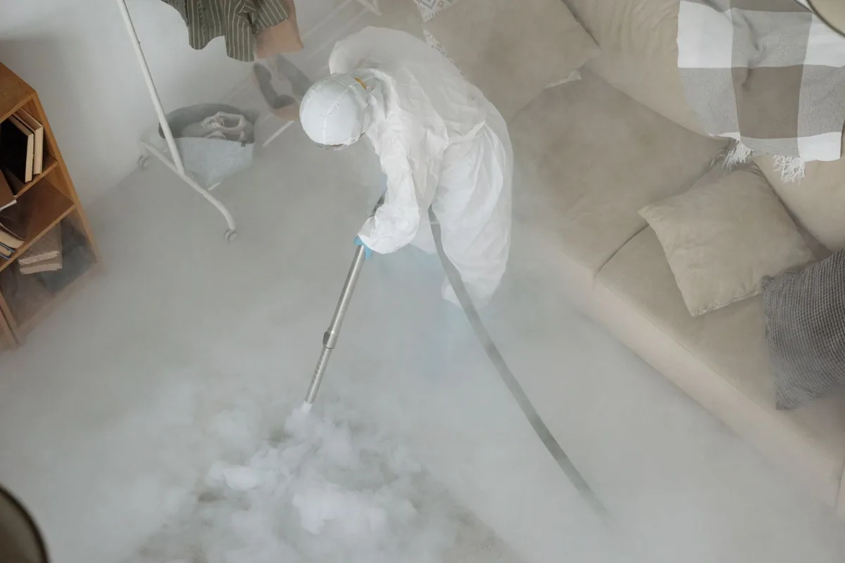 Biohazard cleanup technician in protective equipment, Somerville, TN